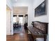 Hallway view to dining room featuring hardwood floors, painted walls and dining room in background at 2261 Mustang Chase Dr, Carmel, IN 46074