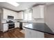 Bright kitchen featuring white cabinets, stainless steel appliances, and modern finishes at 2261 Mustang Chase Dr, Carmel, IN 46074