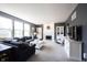 Comfortable living room features a fireplace, plush seating, and abundant natural light, perfect for relaxation at 2261 Mustang Chase Dr, Carmel, IN 46074