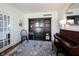 Comfortable sitting room with a piano, stylish furnishings, and natural light, offering a relaxing space at 2261 Mustang Chase Dr, Carmel, IN 46074