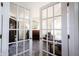 Inviting view of living room through french doors with a piano and stylish furnishings, creating an elegant space at 2261 Mustang Chase Dr, Carmel, IN 46074
