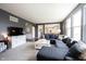 Comfortable living room with a large sectional sofa and plenty of natural light at 2261 Mustang Chase Dr, Carmel, IN 46074