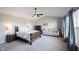Cozy main bedroom with a vaulted ceiling, ceiling fan, and comfortable furnishings, creating a relaxing retreat at 2261 Mustang Chase Dr, Carmel, IN 46074