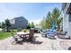 Outdoor patio area features dining table, grill, seating, and patio furniture at 2261 Mustang Chase Dr, Carmel, IN 46074