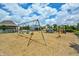 Community playground featuring swings, slides, and climbing structures, perfect for outdoor activities at 2261 Mustang Chase Dr, Carmel, IN 46074