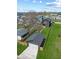 Backyard aerial showing house and garage with fenced yard and mower on the lawn at 2325 E Brookside Ave, Indianapolis, IN 46218