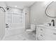 Bright bathroom showcases modern fixtures, a sleek vanity, and a clean, white tub, offering a relaxing retreat at 2325 E Brookside Ave, Indianapolis, IN 46218