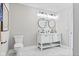Bright bathroom features a double vanity, contemporary mirrors, and modern fixtures, creating a clean and inviting space at 2325 E Brookside Ave, Indianapolis, IN 46218