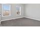 Light-filled bedroom with carpet and large windows offers a bright and airy feel, enhanced by neutral tones at 2325 E Brookside Ave, Indianapolis, IN 46218