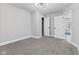 Neutral bedroom with plush carpet, modern lighting, and well-placed doors for ample storage and privacy at 2325 E Brookside Ave, Indianapolis, IN 46218