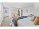 Spacious bedroom features a bed with neutral colors and windows providing plenty of natural light at 2325 E Brookside Ave, Indianapolis, IN 46218