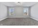 Cozy bedroom boasts natural light and soft carpet, offering comfort and relaxation at 2325 E Brookside Ave, Indianapolis, IN 46218