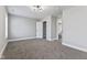 Spacious bedroom showcases neutral walls, plush carpet, and a well-lit closet, offering comfort and ample storage at 2325 E Brookside Ave, Indianapolis, IN 46218