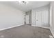 Bright bedroom features neutral walls and soft carpet, creating a serene retreat at 2325 E Brookside Ave, Indianapolis, IN 46218