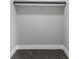 Functional walk-in closet with neutral walls and carpet, ready for organizing your wardrobe and accessories at 2325 E Brookside Ave, Indianapolis, IN 46218