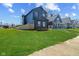 View of exterior of home with long green lawn at 2325 E Brookside Ave, Indianapolis, IN 46218