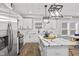 View of the kitchen with a white island and stainless steel appliances at 2325 E Brookside Ave, Indianapolis, IN 46218