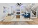Comfortable living room with a fireplace, plush seating, and bright natural light at 2325 E Brookside Ave, Indianapolis, IN 46218