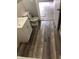 Bathroom with modern wood look flooring, white sink and toilet at 2413 N Macedonia Ave, Muncie, IN 47303