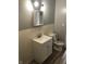 Bathroom with white vanity, toilet and modern wood look floors at 2413 N Macedonia Ave, Muncie, IN 47303