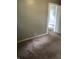 Bedroom with gray walls and tan carpeting at 2413 N Macedonia Ave, Muncie, IN 47303