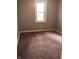 Empty bedroom with gray walls, carpet and white trim at 2413 N Macedonia Ave, Muncie, IN 47303