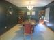 Traditional dining room featuring a wooden table, built-in shelving, and elegant chandelier lighting at 2427 Cedar Bend Dr, Anderson, IN 46011