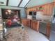 Well-equipped kitchen featuring stainless steel appliances, granite counters, and ample wood cabinetry at 2427 Cedar Bend Dr, Anderson, IN 46011