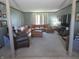 Spacious living room with comfortable seating, natural light, and decorative columns at 2427 Cedar Bend Dr, Anderson, IN 46011