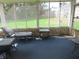 Relaxing sun room with a chaise lounge, patio furniture, and views of the landscaped backyard at 2427 Cedar Bend Dr, Anderson, IN 46011