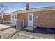 Exterior backyard view of a brick home with a wooden deck and manicured landscaping at 2526 David Dr, Westfield, IN 46074