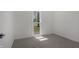 Well-lit bedroom featuring neutral walls, plush carpeting, and a sun-filled window at 2526 David Dr, Westfield, IN 46074