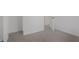 Spacious carpeted bedroom featuring neutral walls and doorways leading to other rooms at 2526 David Dr, Westfield, IN 46074