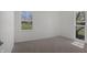 Bright bedroom featuring neutral walls, plush carpeting, and natural light from two windows at 2526 David Dr, Westfield, IN 46074