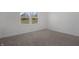 Cozy bedroom showcasing neutral walls, carpeted floor, and a bright window at 2526 David Dr, Westfield, IN 46074