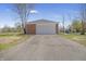 Exterior front view of a detached two car garage with a driveway and green grass at 2526 David Dr, Westfield, IN 46074