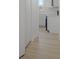 Hallway view of the renovated kitchen with a white subway tile backsplash at 2526 David Dr, Westfield, IN 46074