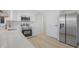 Modern kitchen featuring white cabinets, stainless steel appliances, and sleek countertops at 2526 David Dr, Westfield, IN 46074
