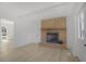 Living room featuring a brick fireplace, hardwood floors, and a neutral color palette at 2526 David Dr, Westfield, IN 46074