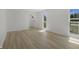 Inviting living room with hardwood floors and a large window showcasing the landscape at 2526 David Dr, Westfield, IN 46074