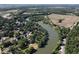 Gorgeous aerial view of the river running through the landscape with lush trees and farmland at 256 Riverwood Dr, Noblesville, IN 46062