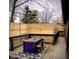Cozy outdoor deck with dining set and wooden privacy fence, perfect for entertaining guests at 256 Riverwood Dr, Noblesville, IN 46062