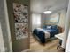Charming bedroom with colorful artwork, comfortable bedding, and warm ambiance at 256 Riverwood Dr, Noblesville, IN 46062