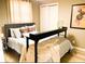 Comfortable bedroom with stylish decor, neutral tones, and plenty of natural light at 256 Riverwood Dr, Noblesville, IN 46062