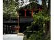 Unique home featuring multi-tiered decks and covered parking, surrounded by mature trees at 256 Riverwood Dr, Noblesville, IN 46062