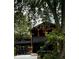 Unique home featuring multi-tiered decks and covered parking, surrounded by mature trees at 256 Riverwood Dr, Noblesville, IN 46062