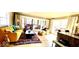 Inviting living room with a vibrant rug, comfortable seating, and access to an outdoor deck at 256 Riverwood Dr, Noblesville, IN 46062