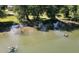 Scenic river view with kayaks and people enjoying the water on a sunny day, surrounded by lush greenery at 256 Riverwood Dr, Noblesville, IN 46062