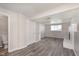 Open basement space showcasing updated flooring and ample natural light from a bright window at 2601 Fairhaven Dr, Indianapolis, IN 46229