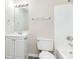 Bathroom featuring a white vanity, large mirror with lighting, and a white toilet and shower at 2601 Fairhaven Dr, Indianapolis, IN 46229
